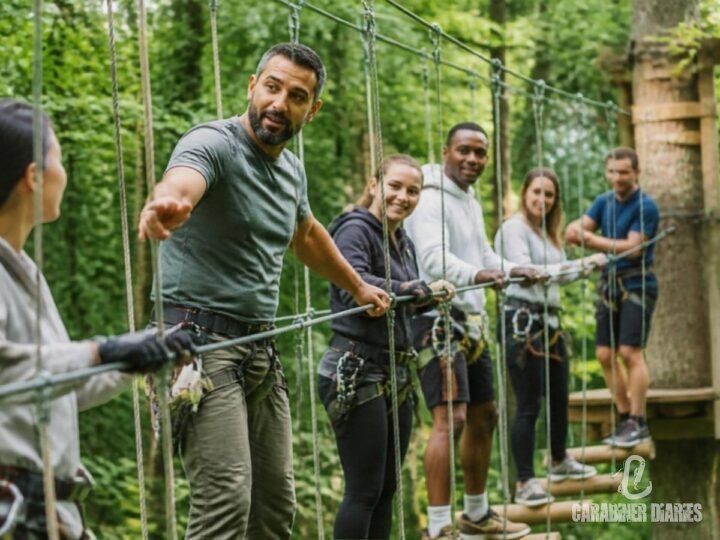 Team leader guiding colleagues through an outdoor rope challenge course